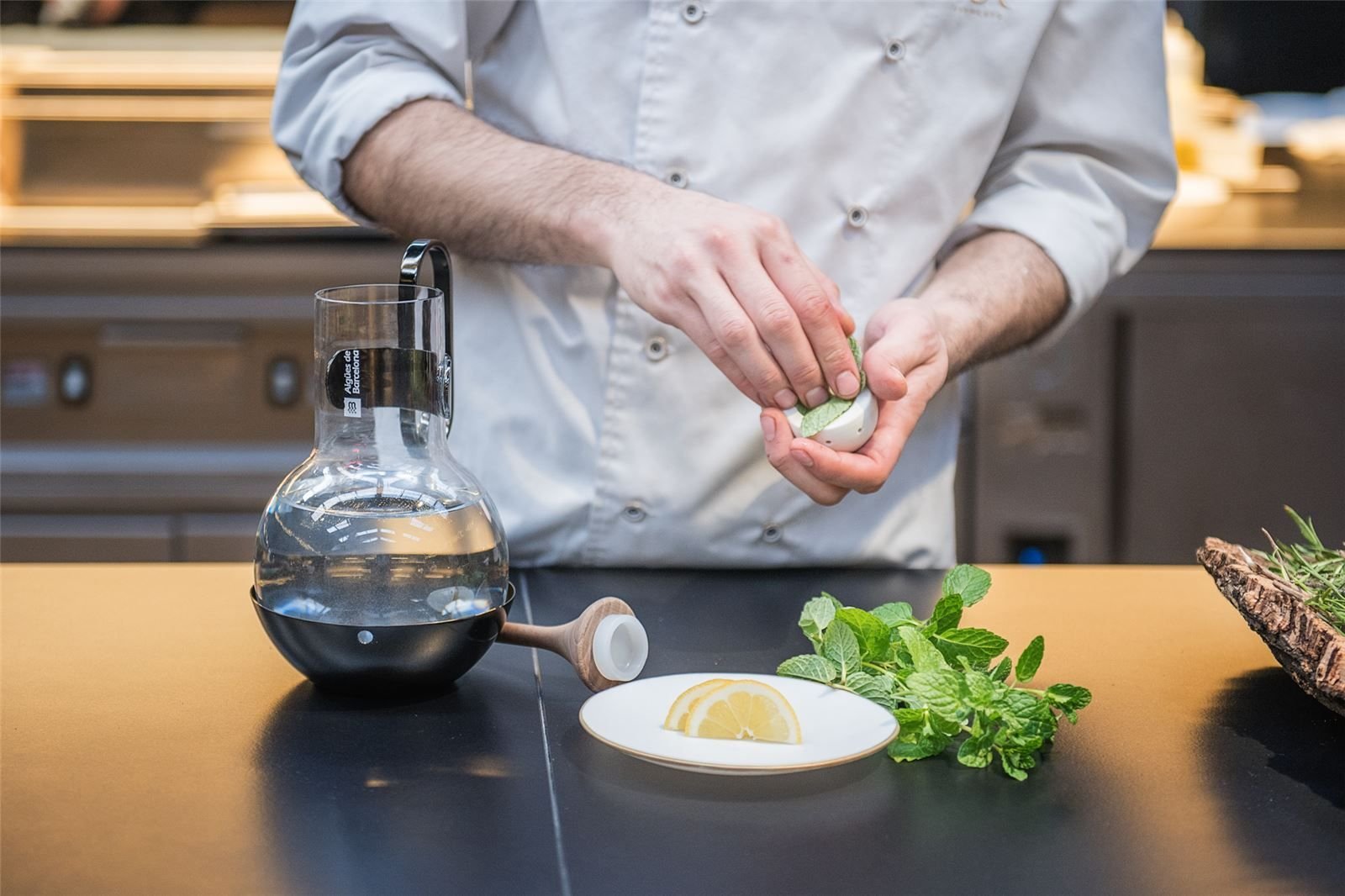 The chef prepares flavour notes next to the Ritual bottle and whisk